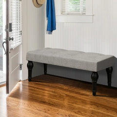 Soft grey 42-inch Ottoman bench with linen fabric, button-tufted seat, Roman column feet, and skid foot pads.