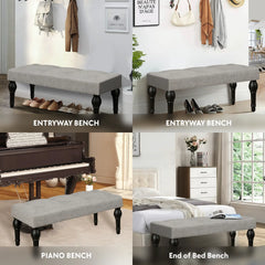 Soft grey 42-inch Ottoman bench with linen fabric, button-tufted seat, Roman column feet, and skid foot pads.