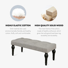 Soft grey 42-inch Ottoman bench with linen fabric, button-tufted seat, Roman column feet, and skid foot pads.