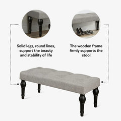Soft grey 42-inch Ottoman bench with linen fabric, button-tufted seat, Roman column feet, and skid foot pads.