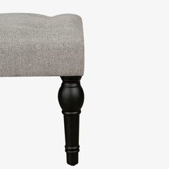 Soft grey 42-inch Ottoman bench with linen fabric, button-tufted seat, Roman column feet, and skid foot pads.