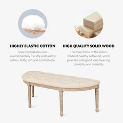 Beige Ottoman Bench with vintage half-moon design, fluted legs, linen cushion, and skid foot pads.